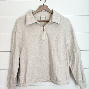 Varley women’s beige 1/2 zip shorter style long sleeve top Size medium